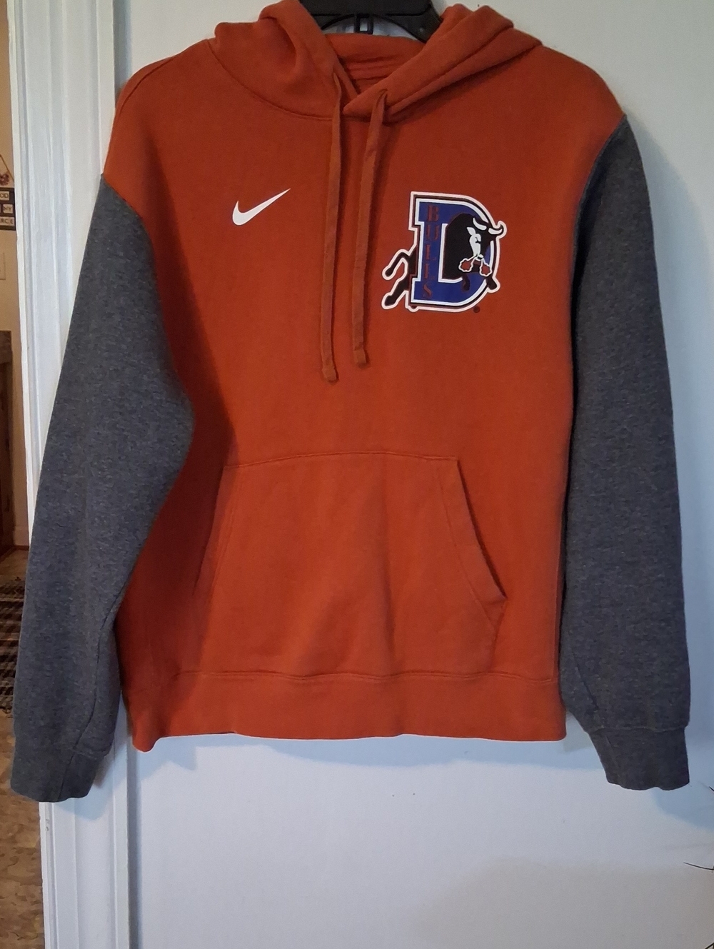 Nike Orange Pullover Hoodie with Gray Sleeves and Team Lettering